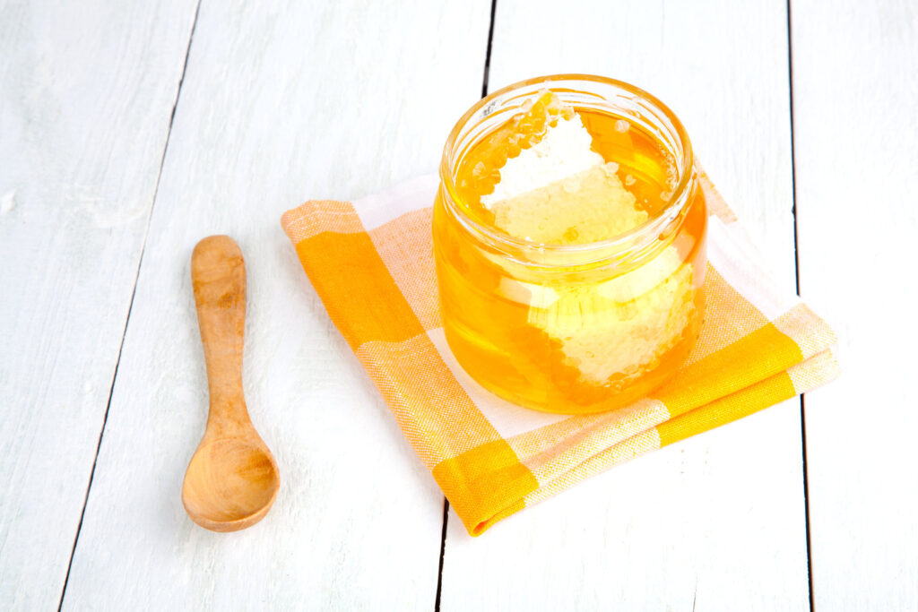honey with a wooden spoon