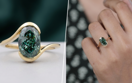 Oval green diamond ring with curved yellow gold band on hand